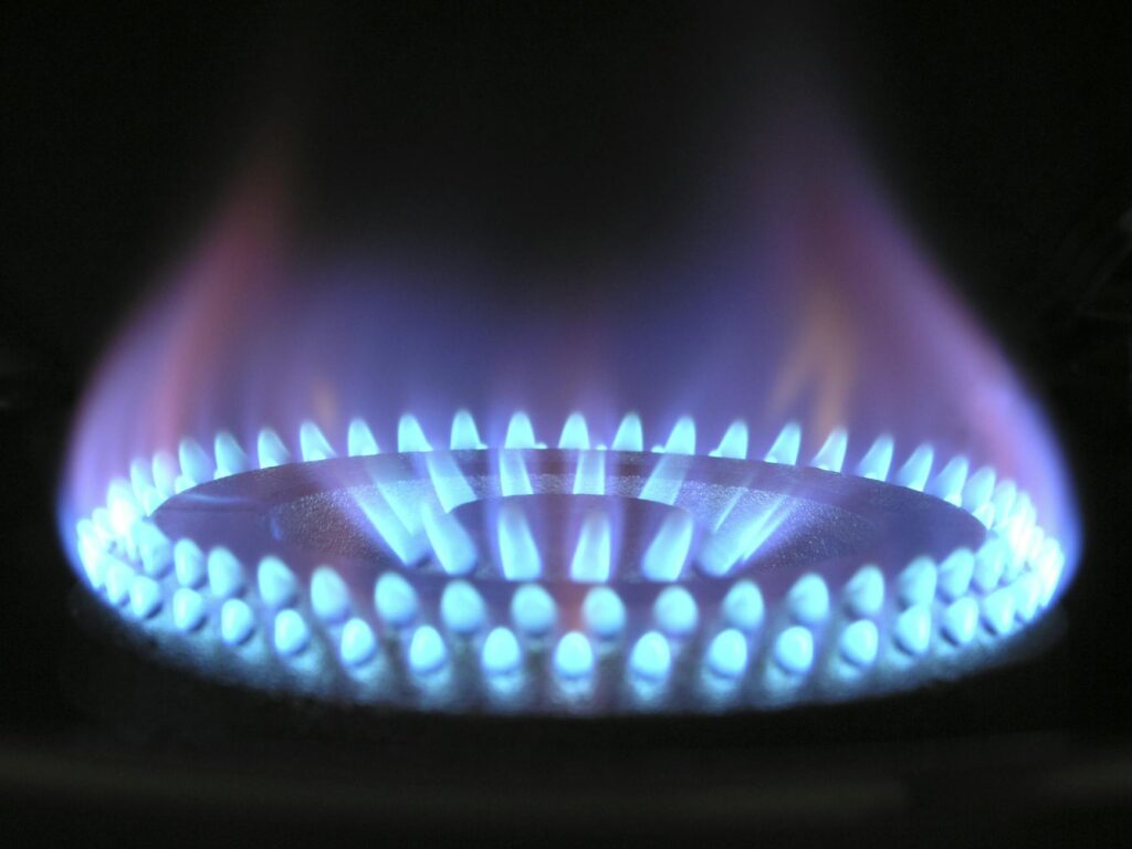 a lit gas cooktop